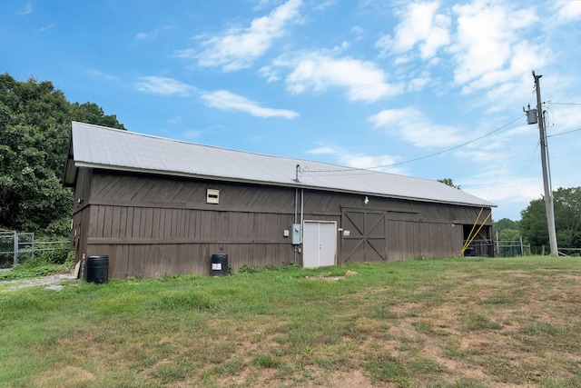 view of outbuilding featuring a yard