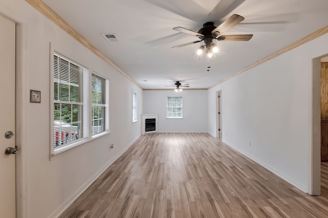 unfurnished living room with crown molding, ceiling fan, and wood-type flooring