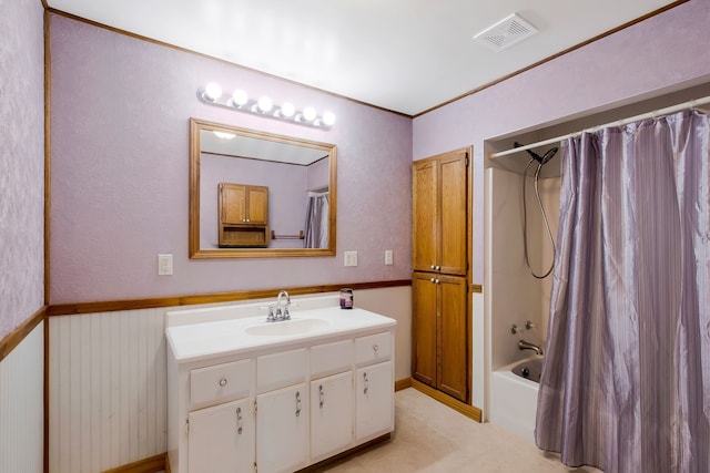 bathroom with vanity and shower / tub combo with curtain