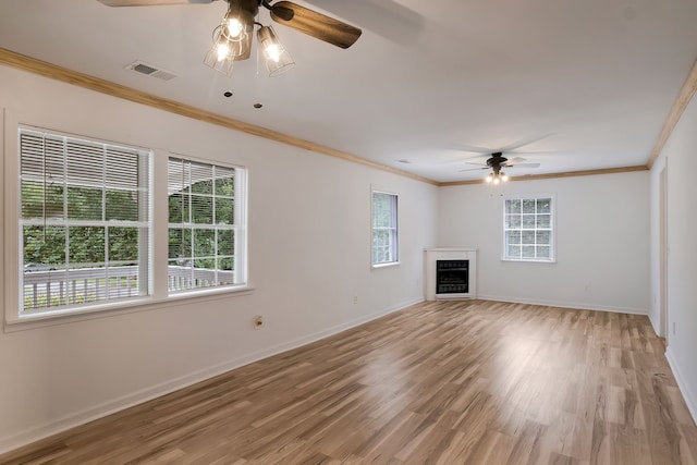 unfurnished living room with crown molding, hardwood / wood-style floors, and ceiling fan