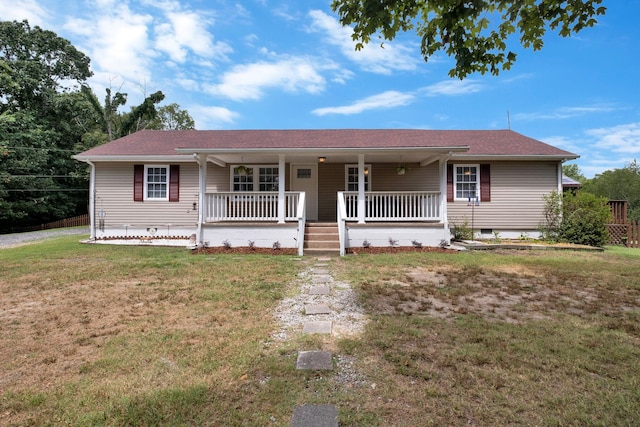 single story home with a front yard and covered porch