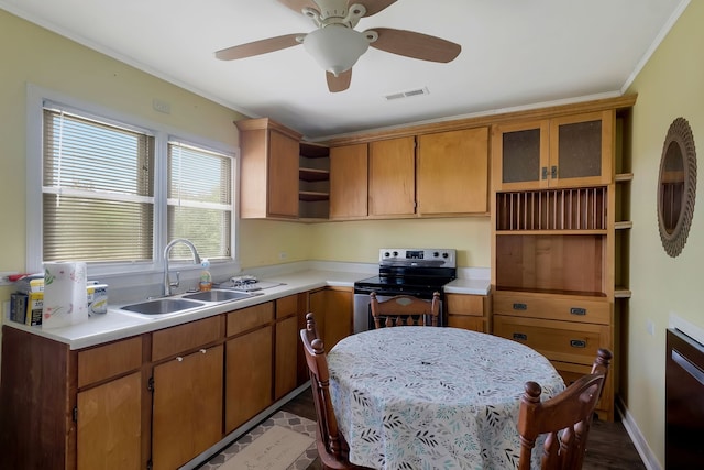 kitchen with crown molding, light wood-type flooring, sink, ceiling fan, and stainless steel range with electric cooktop