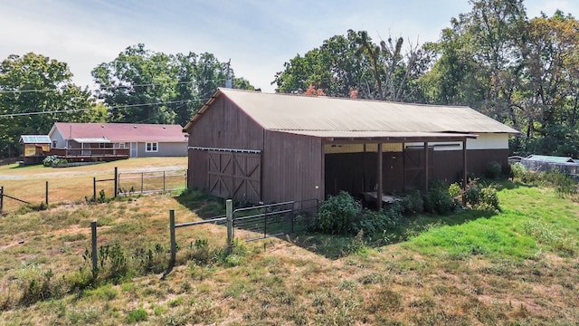 view of outdoor structure featuring a lawn