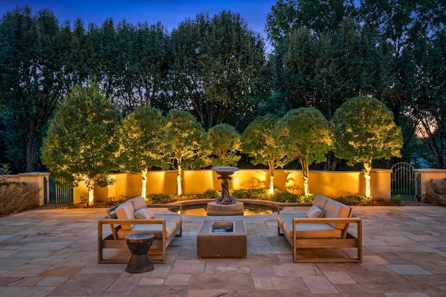 view of patio terrace at dusk