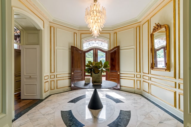 sitting room featuring a wealth of natural light, french doors, a notable chandelier, and ornamental molding