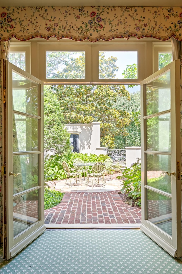 entryway with carpet floors