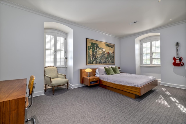 carpeted bedroom featuring ornamental molding