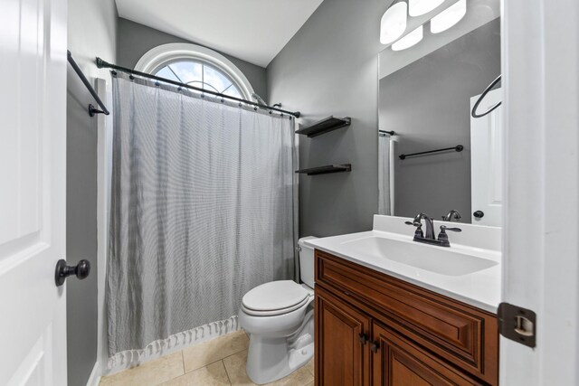 bathroom with tile patterned flooring, toilet, and vanity