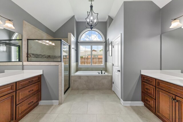 bathroom featuring vanity, separate shower and tub, tile patterned flooring, and a chandelier