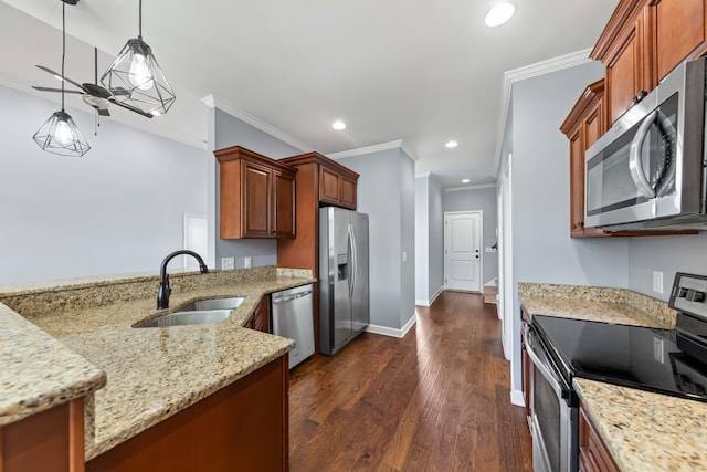 kitchen featuring stainless steel appliances, sink, pendant lighting, light stone countertops, and dark wood-type flooring