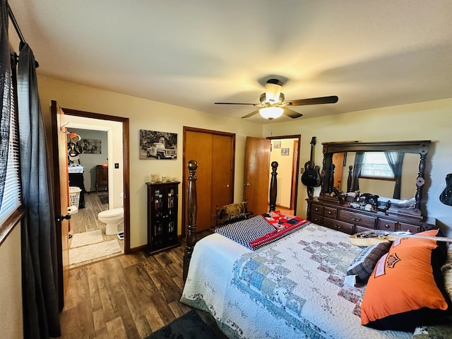 bedroom featuring dark hardwood / wood-style floors, connected bathroom, and ceiling fan