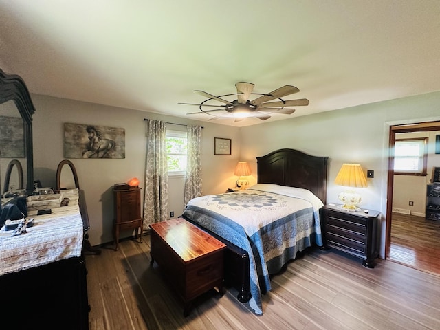 bedroom featuring wood-type flooring and ceiling fan