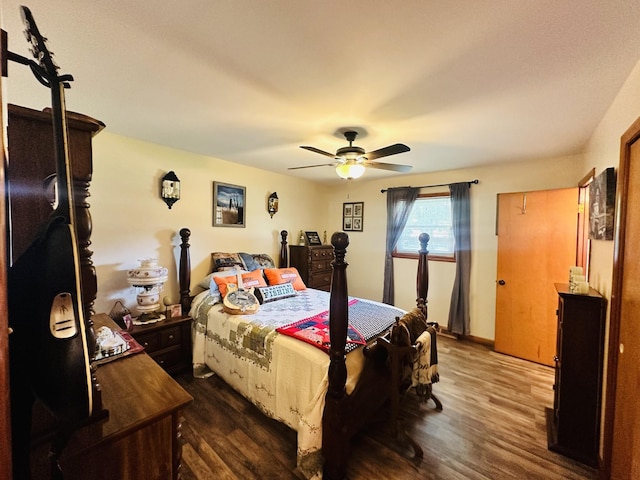 bedroom with dark wood-type flooring and ceiling fan