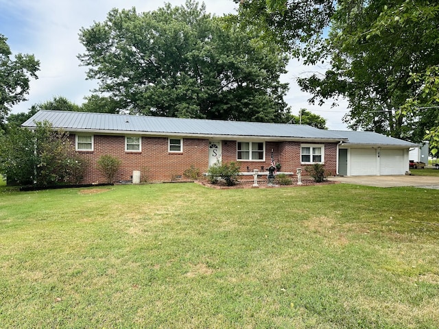 single story home featuring a garage and a front yard