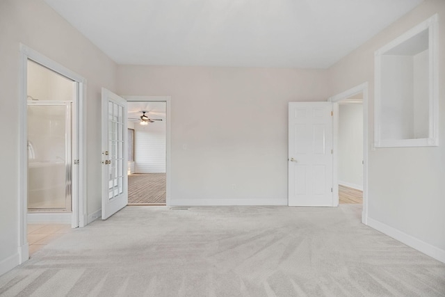 empty room with light carpet and baseboards