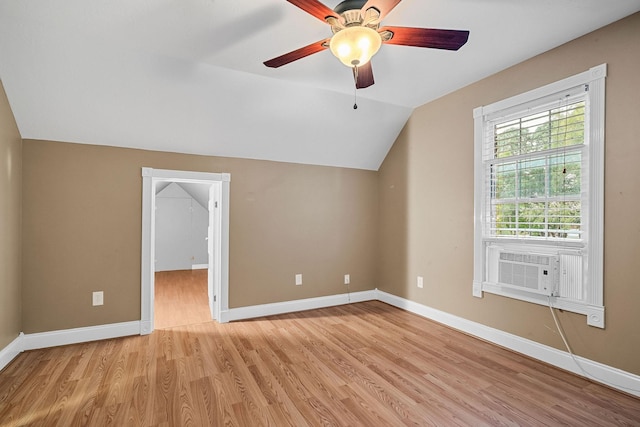 bonus room with light wood finished floors, baseboards, lofted ceiling, ceiling fan, and cooling unit