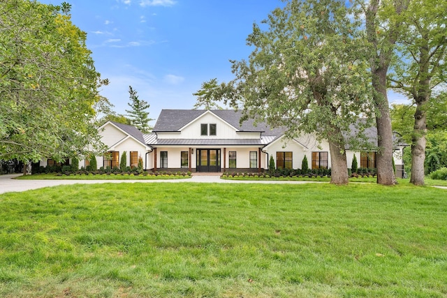 modern farmhouse with a front yard