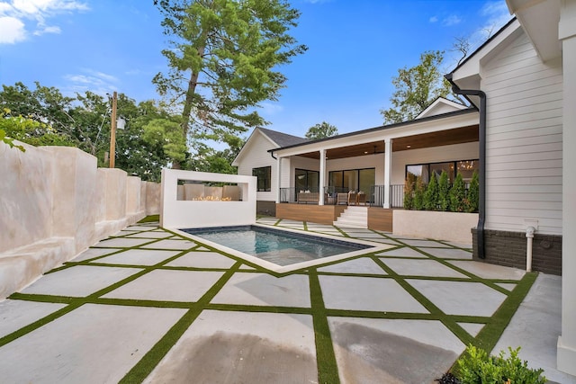 view of swimming pool featuring a patio