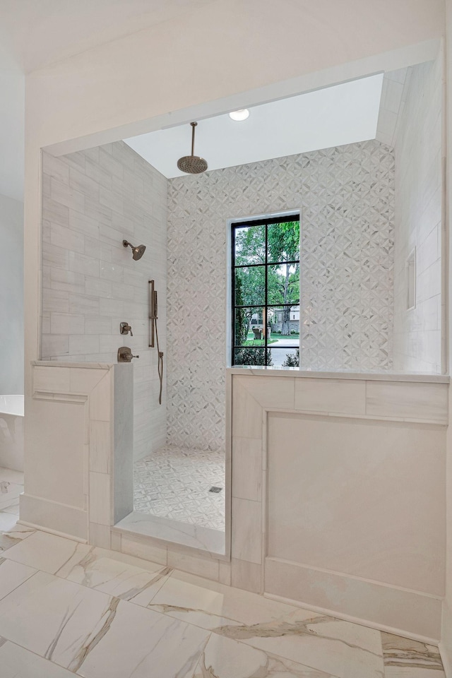 bathroom with a tile shower