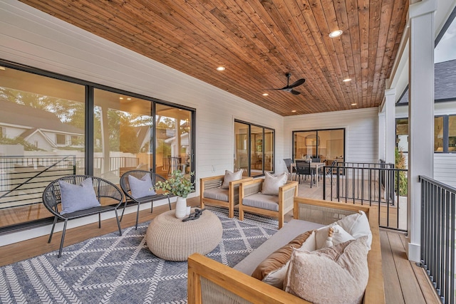 interior space with wood ceiling and ceiling fan