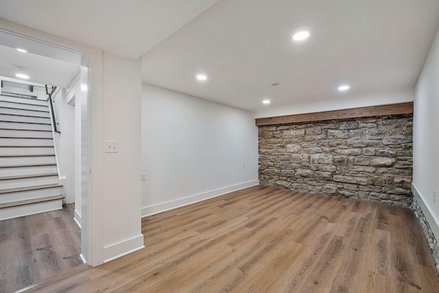 basement featuring light wood-type flooring