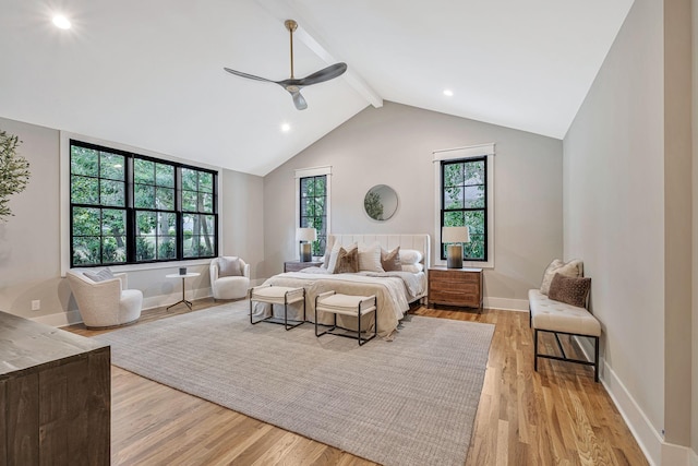 bedroom featuring lofted ceiling with beams, light wood-type flooring, and ceiling fan