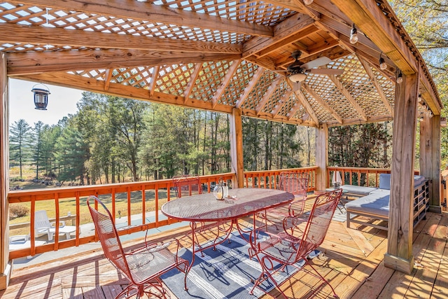 wooden deck featuring ceiling fan