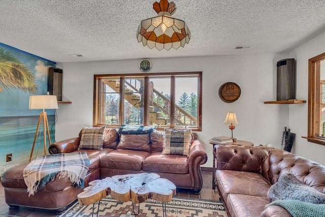 living room with a textured ceiling