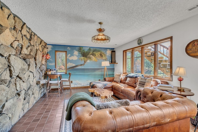 tiled living room with a textured ceiling