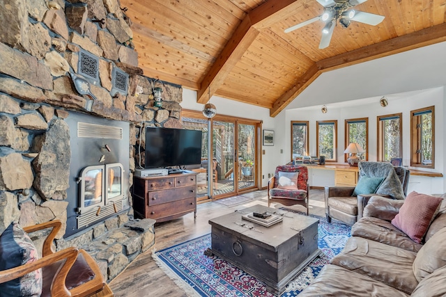 living room featuring light wood-type flooring, ceiling fan, beamed ceiling, wooden ceiling, and high vaulted ceiling