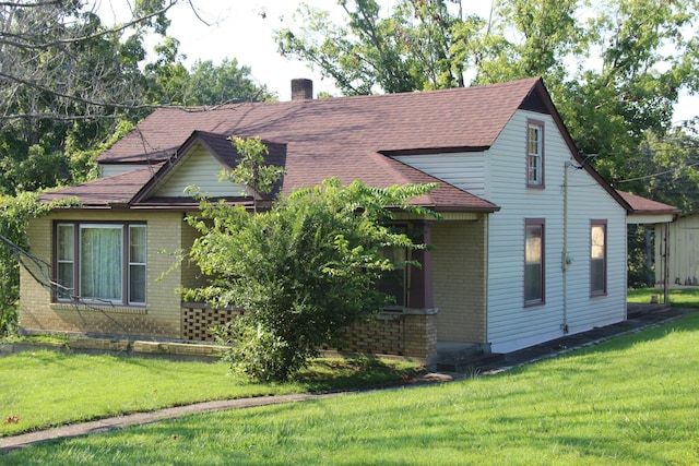 view of property exterior with a yard