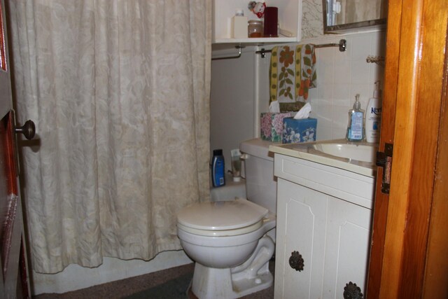 bathroom featuring vanity and toilet