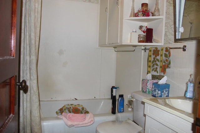 full bathroom featuring vanity, shower / tub combo with curtain, and toilet