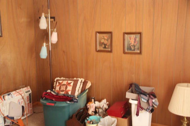 bedroom featuring wood walls