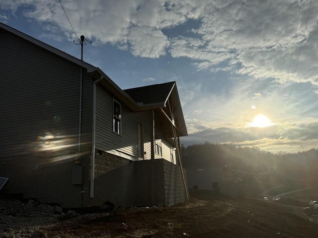 view of property exterior at dusk