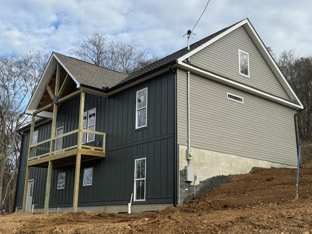 2055 Collier Rd, Lewisburg, TN 37091 - view of side of home featuring a balcony, roof with shingles, and board and batten siding
