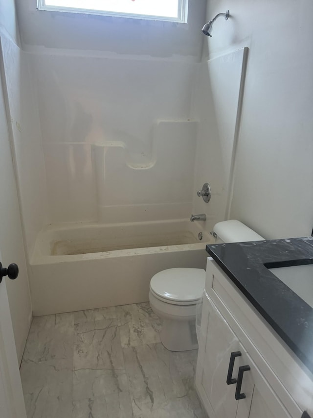 full bathroom featuring vanity, toilet, and washtub / shower combination