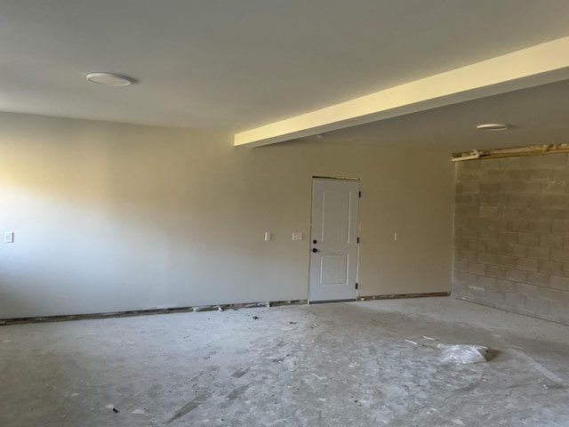 unfurnished room featuring concrete flooring