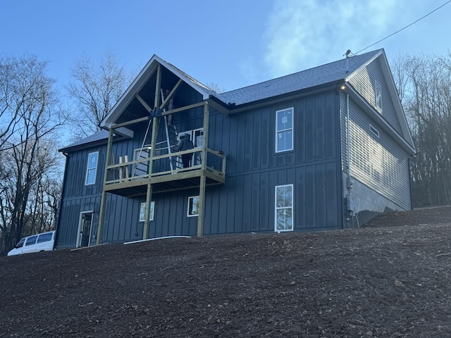 rear view of house featuring a balcony