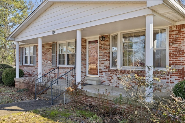 doorway to property featuring covered porch