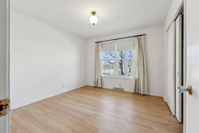 unfurnished room featuring light hardwood / wood-style flooring