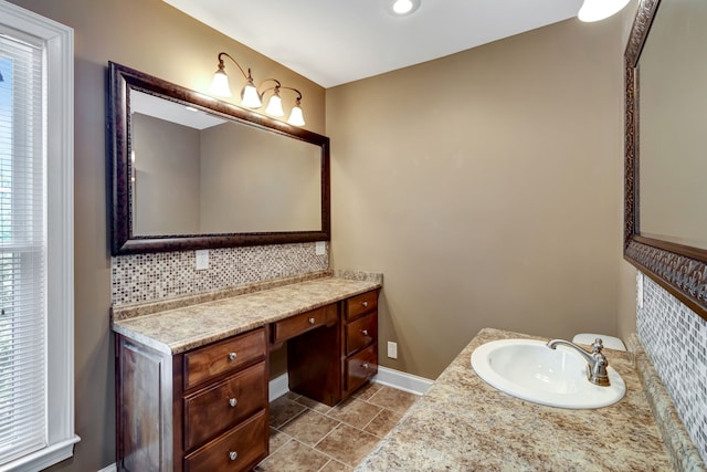 bathroom with vanity, decorative backsplash, and tile patterned floors