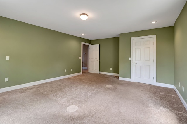 unfurnished bedroom with a closet and carpet floors