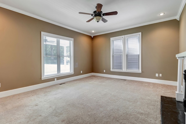 unfurnished living room with carpet flooring, ceiling fan, and crown molding