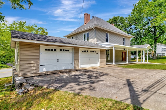 view of front facade with a porch and a garage