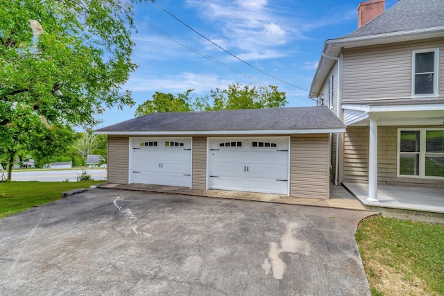 garage featuring a yard