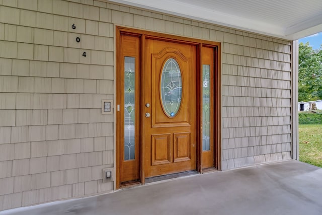 entrance to property featuring a porch