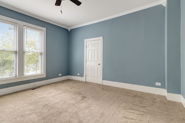 unfurnished room with carpet floors, plenty of natural light, and ceiling fan