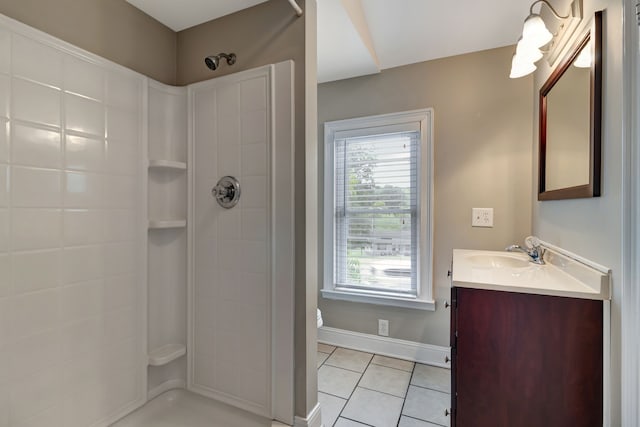 bathroom featuring walk in shower, tile patterned floors, and vanity