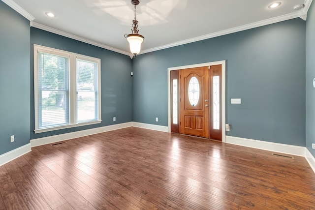 entrance foyer featuring crown molding and dark hardwood / wood-style floors